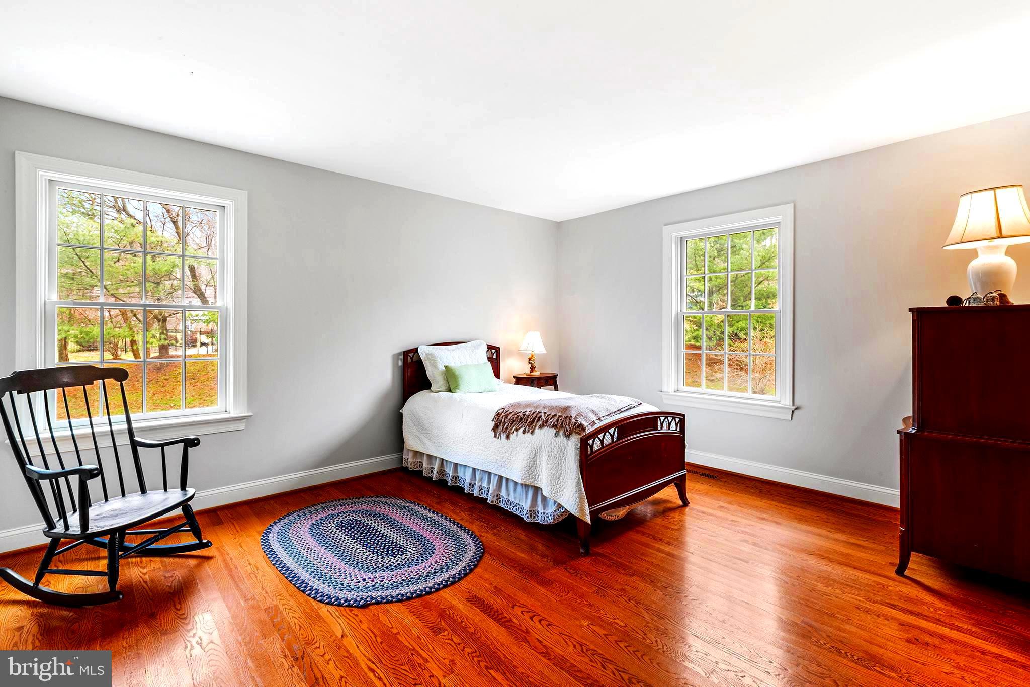 371 Trillium Lane Wayne, PA 19087 - Photo 36 of 43 a bedroom with wooden floor and a window