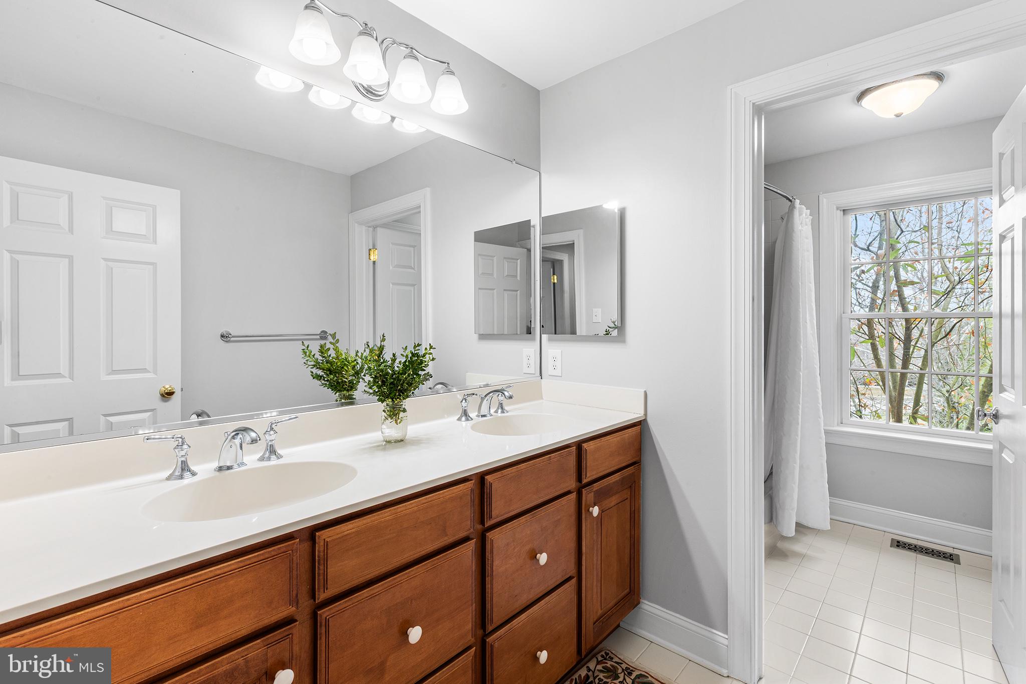 371 Trillium Lane Wayne, PA 19087 - Photo 37 of 43 a bathroom with a sink double vanity and a mirror