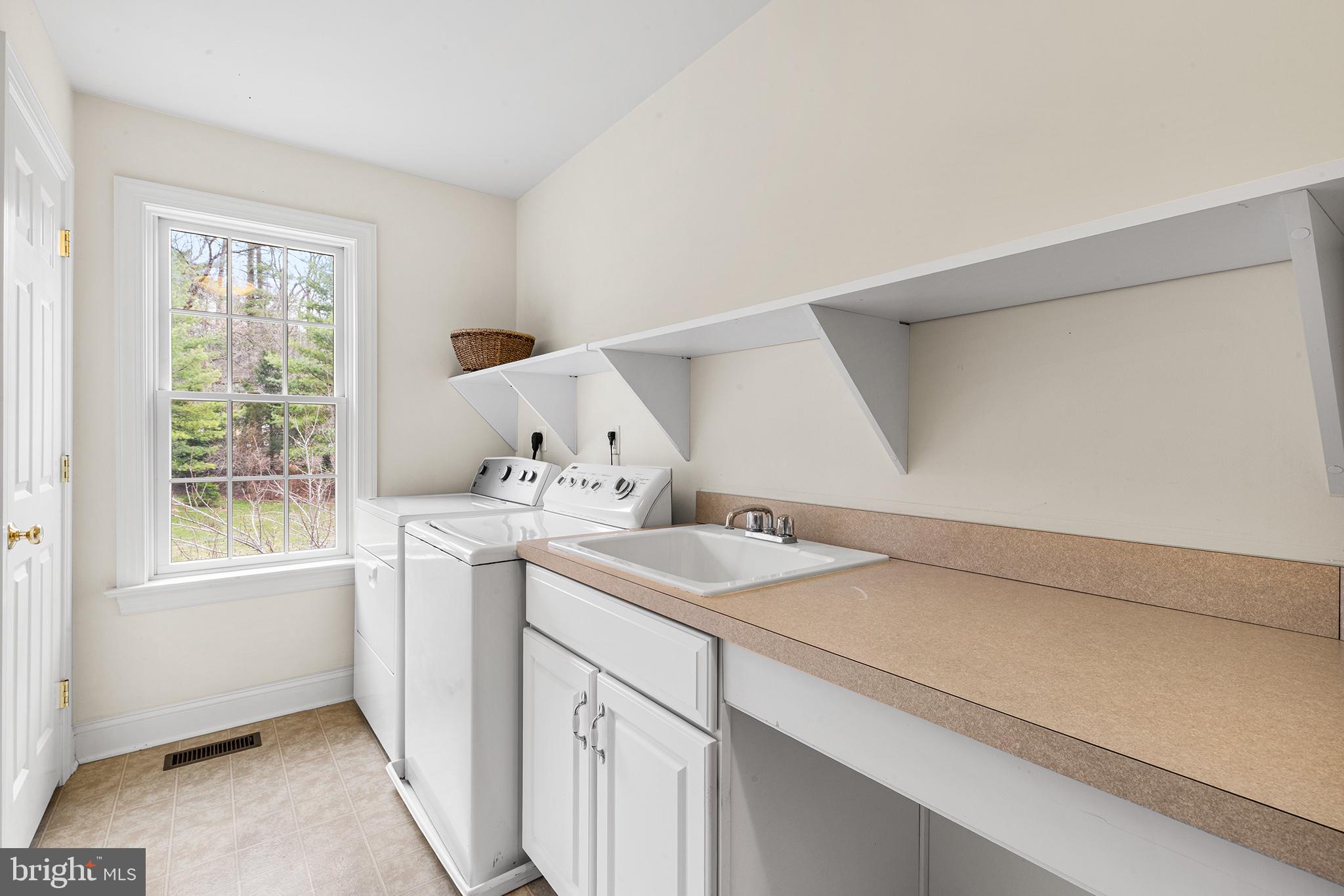 371 Trillium Lane Wayne, PA 19087 - Photo 38 of 43 a utility room with dryer and washer