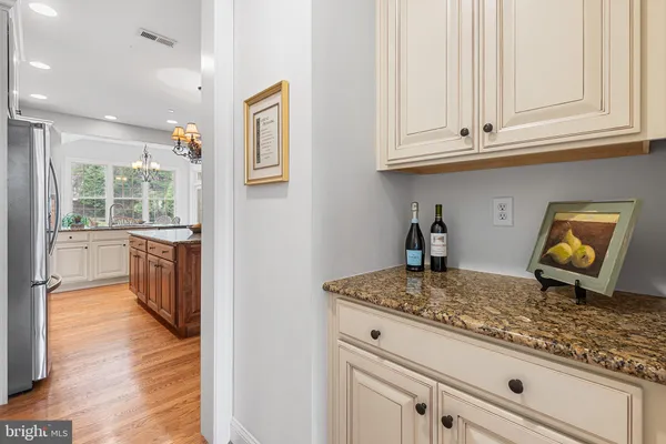 a kitchen with sink and cabinets