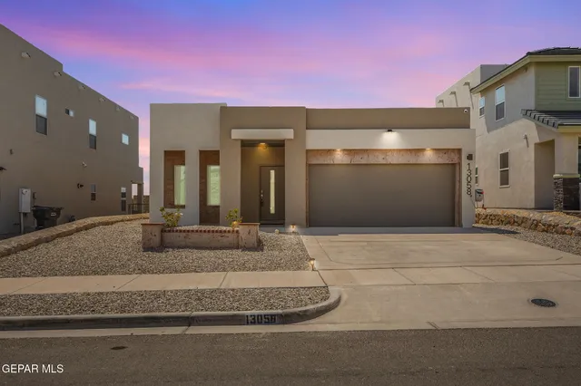 a bathroom with a granite countertop sink and mirror