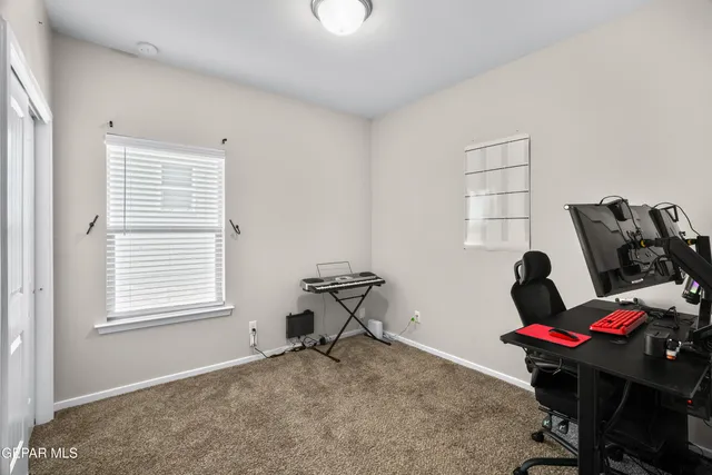 a workspace with furniture and window