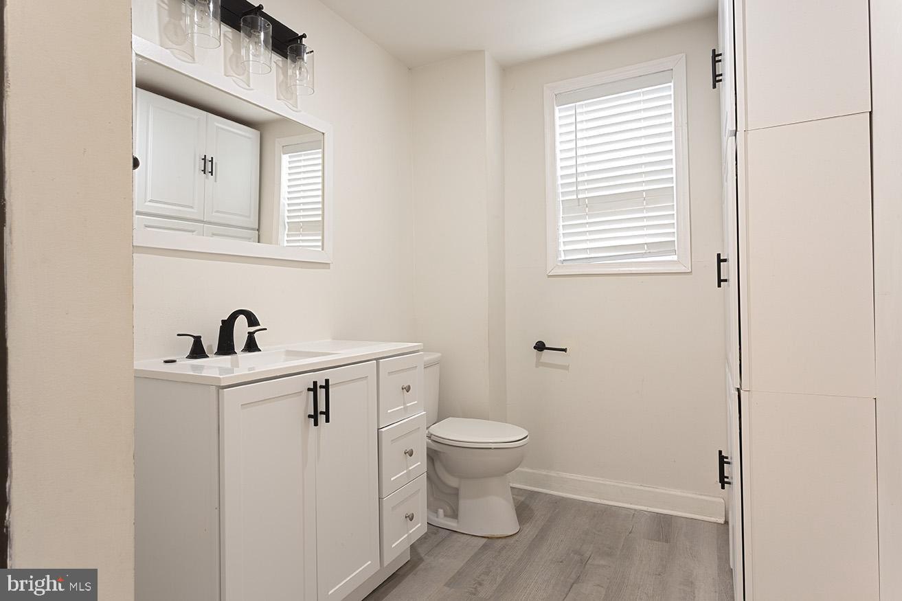 417 North 2nd Street Reading, PA 19601 - Photo 17 of 22 a bathroom with a sink a toilet and window