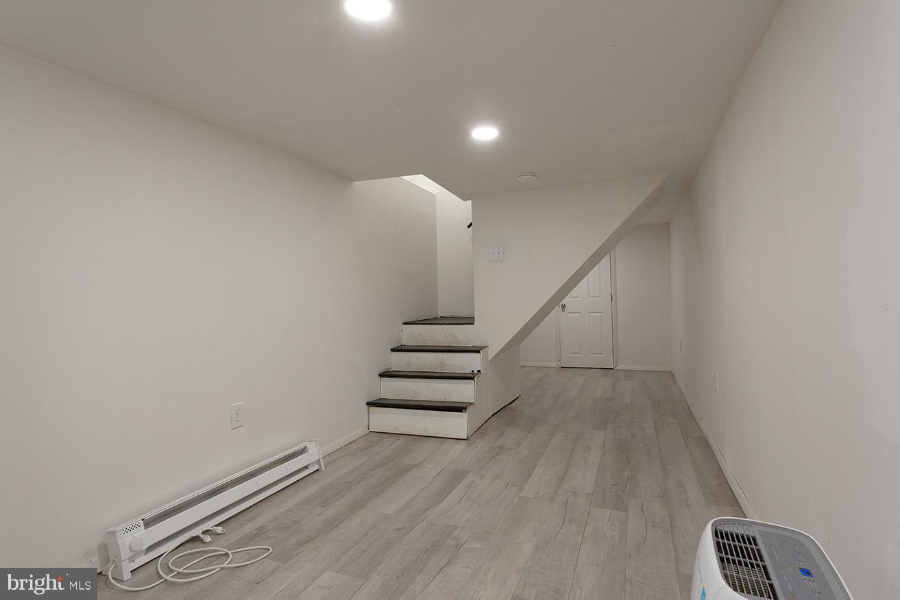 417 North 2nd Street Reading, PA 19601 - Photo 21 of 22 a view of entryway with stairs and wooden floor