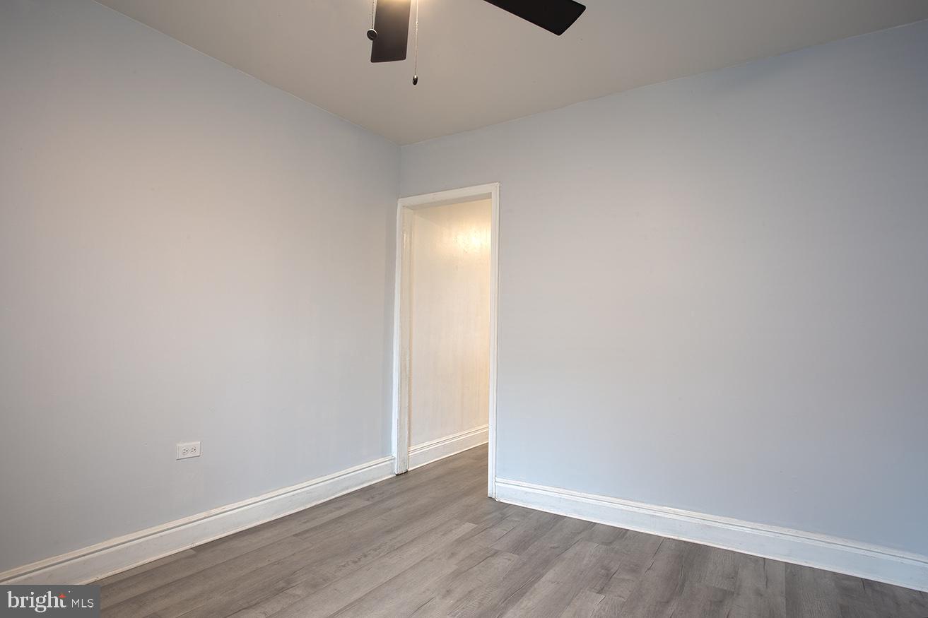 417 North 2nd Street Reading, PA 19601 - Photo 4 of 22 an empty room with a empty space and a ceiling fan