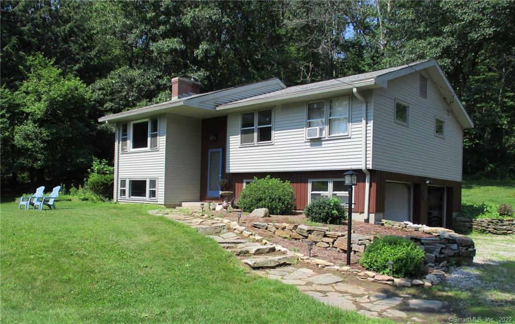 48 Fiora Road Bolton, CT 06043 - Photo 1 of 1 a front view of a house with a yard
