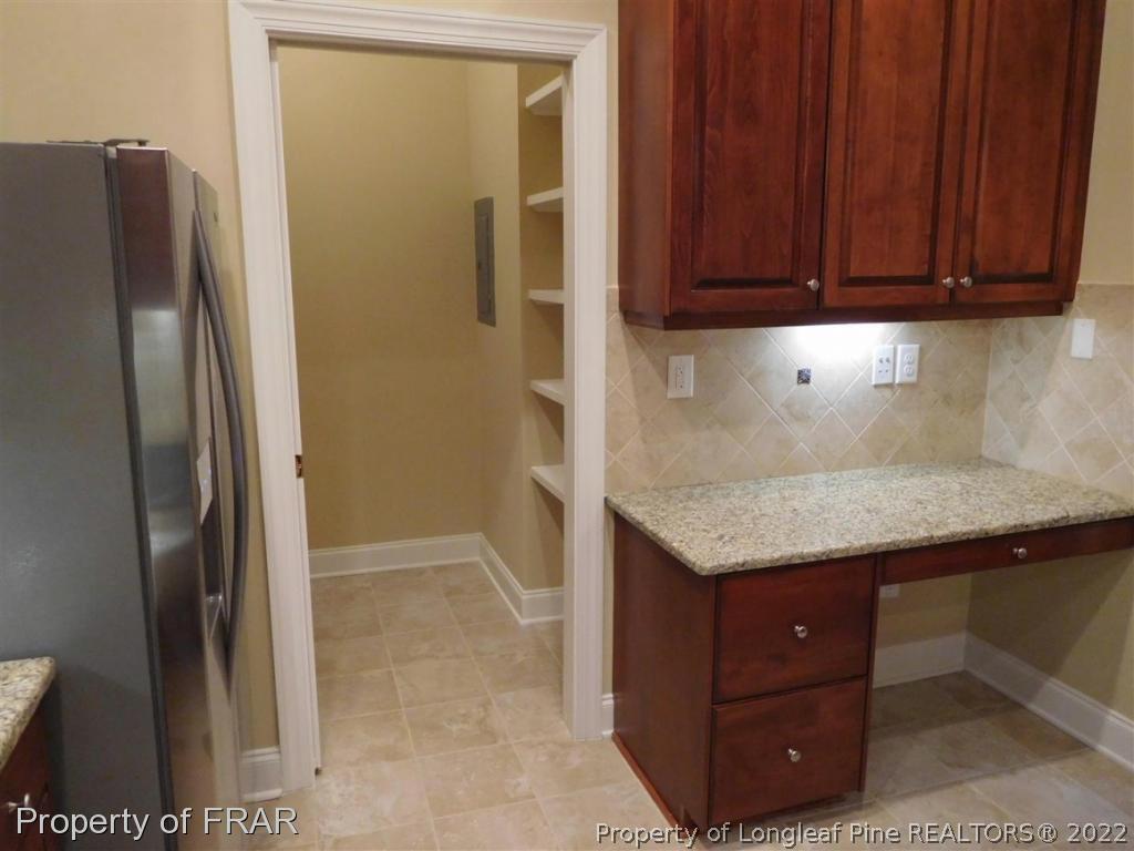 2641 Lockwood Road, Unit 202 Fayetteville, NC 28303 - Photo 14 of 36 a kitchen with stainless steel appliances granite countertop a refrigerator and a sink