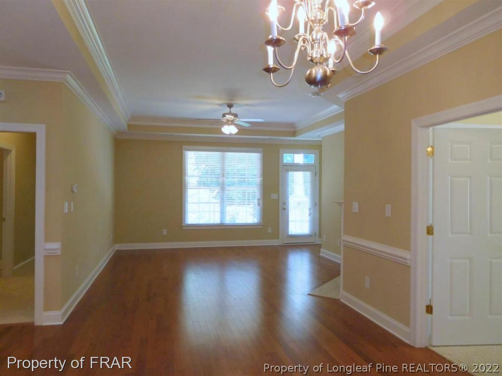 2641 Lockwood Road, Unit 202 Fayetteville, NC 28303 - Photo 16 of 36 a view of an empty room with wooden floor and a window