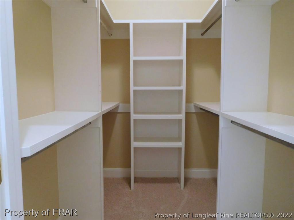 2641 Lockwood Road, Unit 202 Fayetteville, NC 28303 - Photo 20 of 36 a view of walk in closet with empty racks