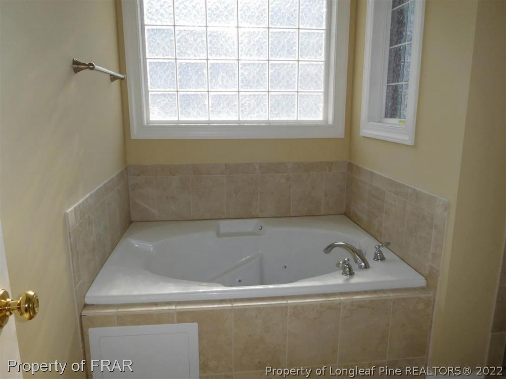 2641 Lockwood Road, Unit 202 Fayetteville, NC 28303 - Photo 24 of 36 a close up of a bathtub