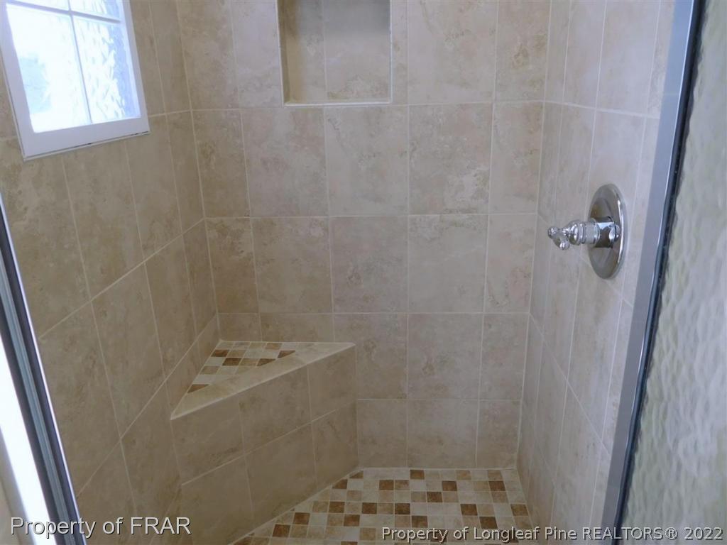 2641 Lockwood Road, Unit 202 Fayetteville, NC 28303 - Photo 25 of 36 a bathroom with a shower