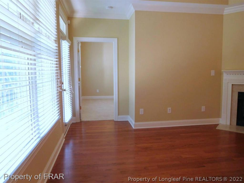 2641 Lockwood Road, Unit 202 Fayetteville, NC 28303 - Photo 26 of 36 a view of an empty room with wooden floor and a window