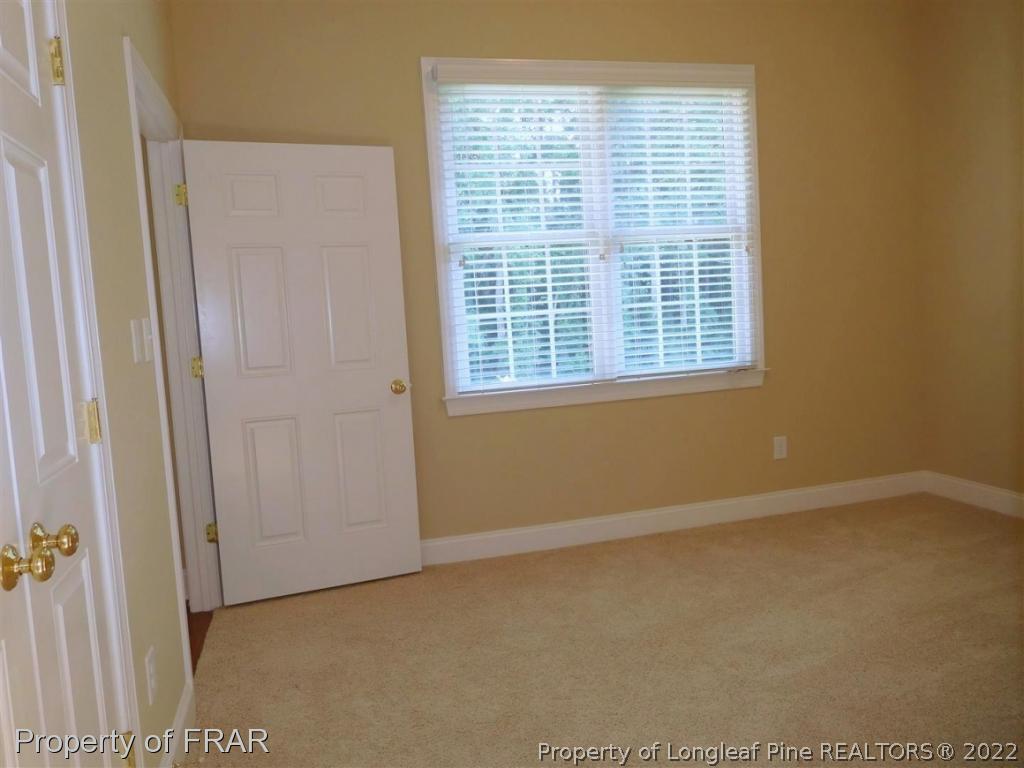 2641 Lockwood Road, Unit 202 Fayetteville, NC 28303 - Photo 27 of 36 a view of an empty room with a window
