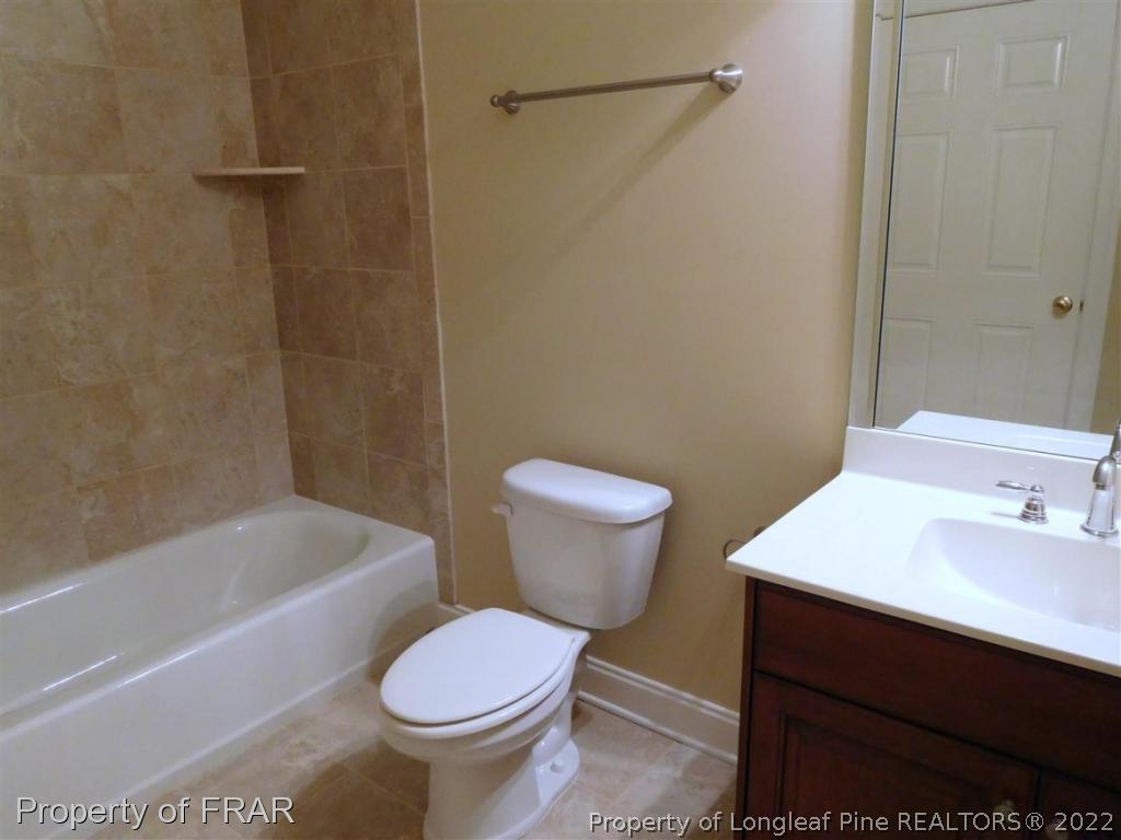 2641 Lockwood Road, Unit 202 Fayetteville, NC 28303 - Photo 31 of 36 a bathroom with a sink toilet and shower
