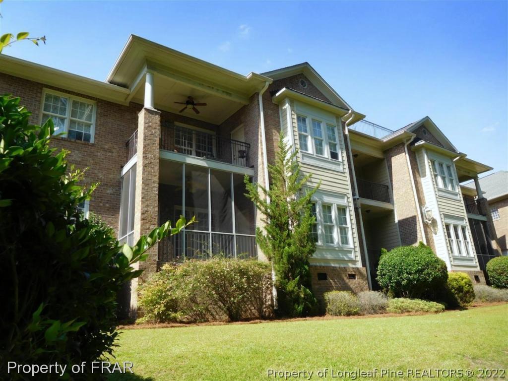 2641 Lockwood Road, Unit 202 Fayetteville, NC 28303 - Photo 35 of 36 a front view of a house with garden