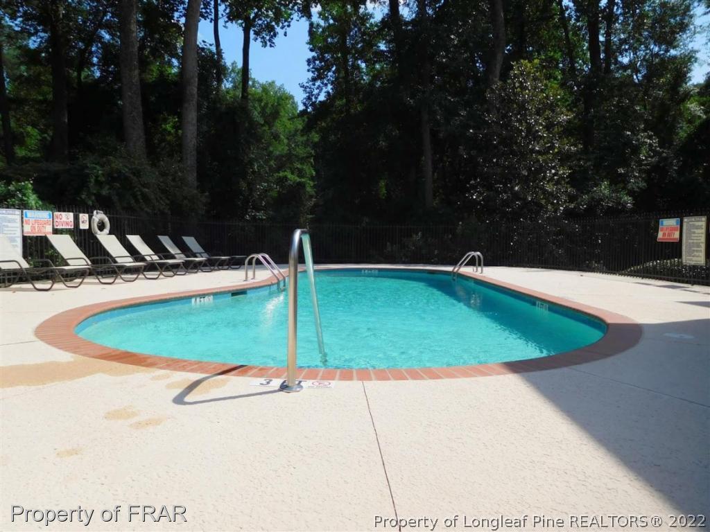 2641 Lockwood Road, Unit 202 Fayetteville, NC 28303 - Photo 36 of 36 a view of a swimming pool with a patio