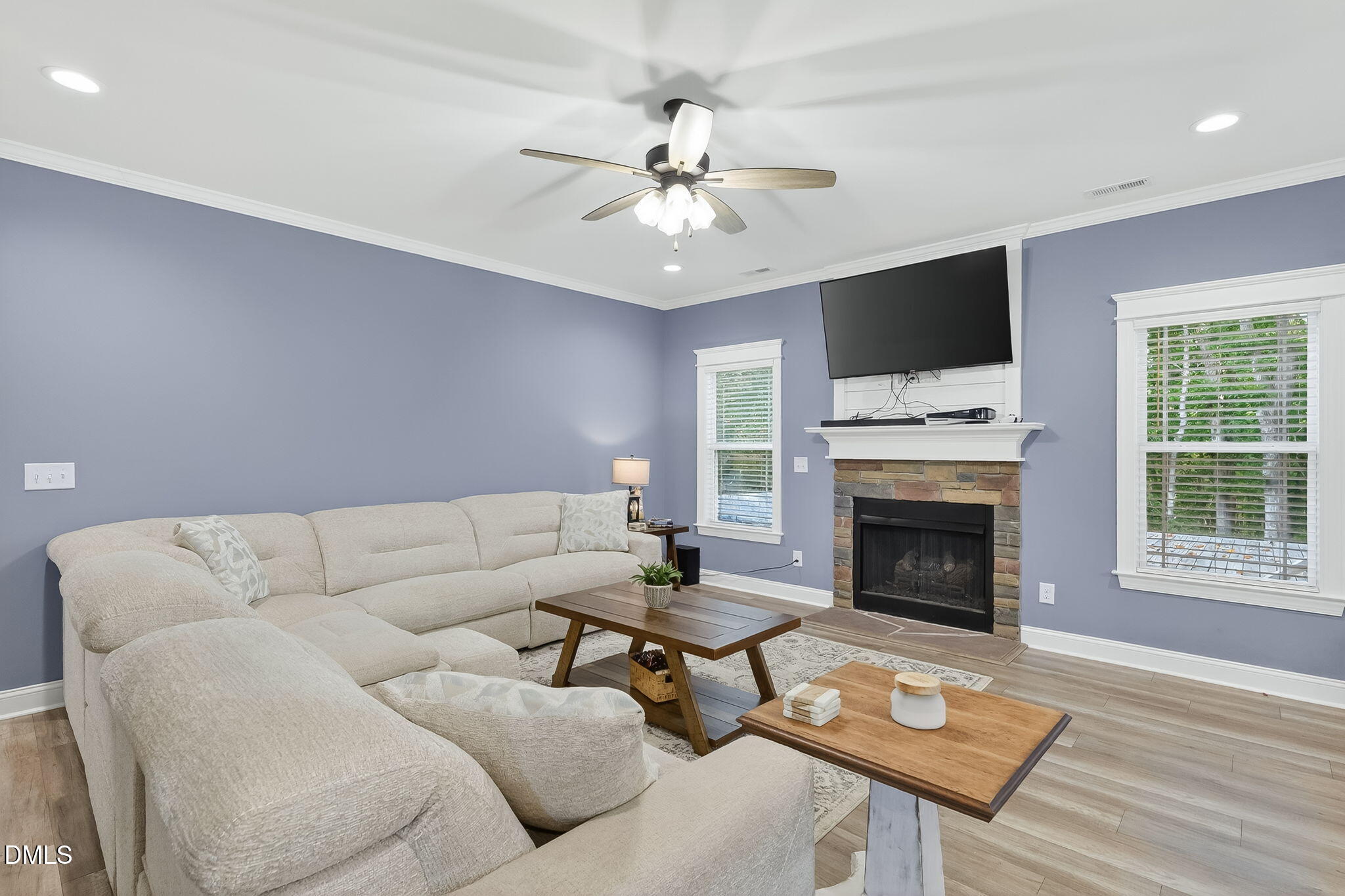 238 Deer Path Farms Road Erwin, NC 28339 - Photo 11 of 49 a living room with furniture a fireplace and a flat screen tv