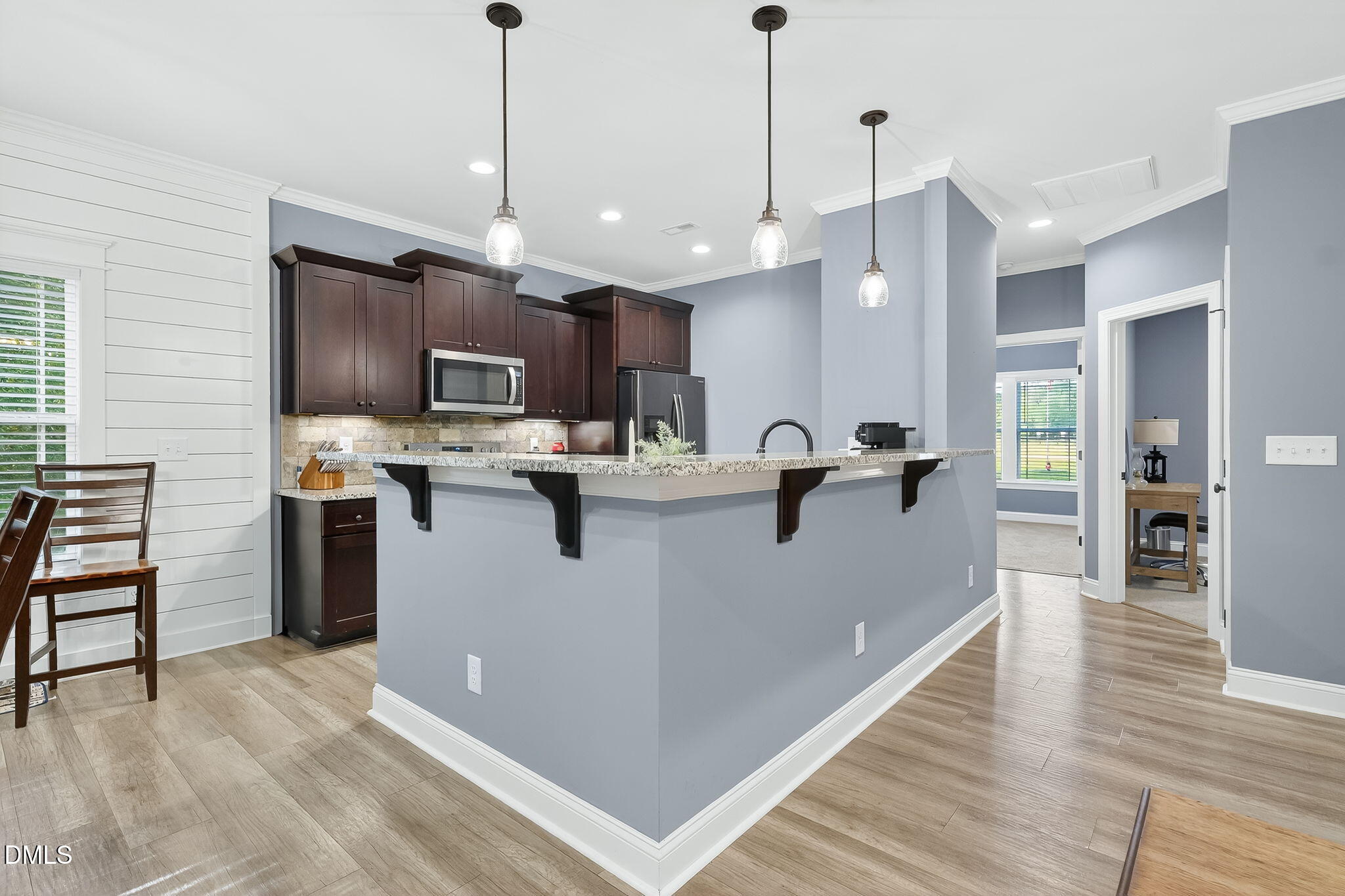 238 Deer Path Farms Road Erwin, NC 28339 - Photo 16 of 49 a view of a kitchen with kitchen island a counter space a sink appliances and cabinets