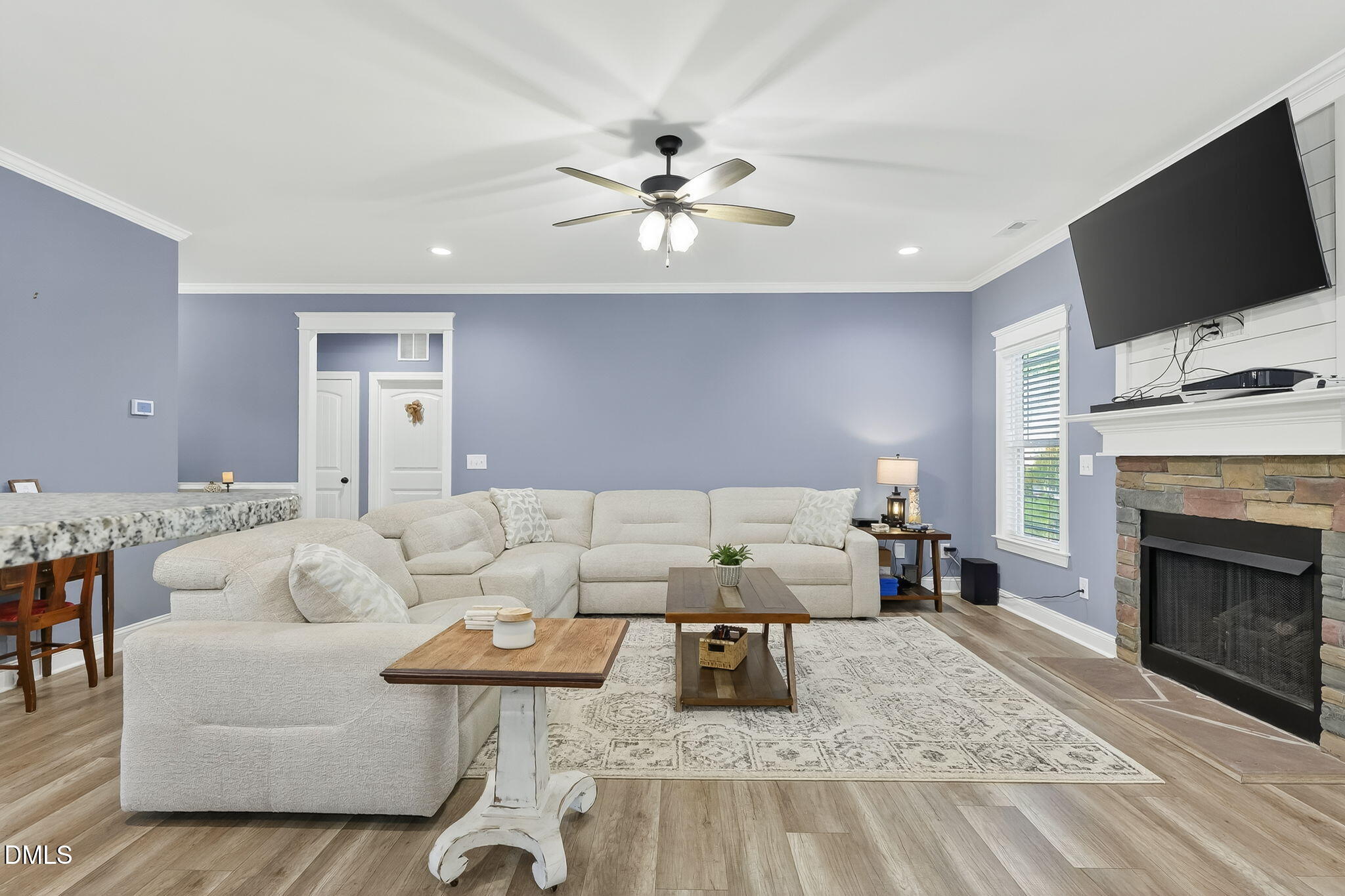 238 Deer Path Farms Road Erwin, NC 28339 - Photo 17 of 49 a living room with furniture a fireplace and a flat screen tv