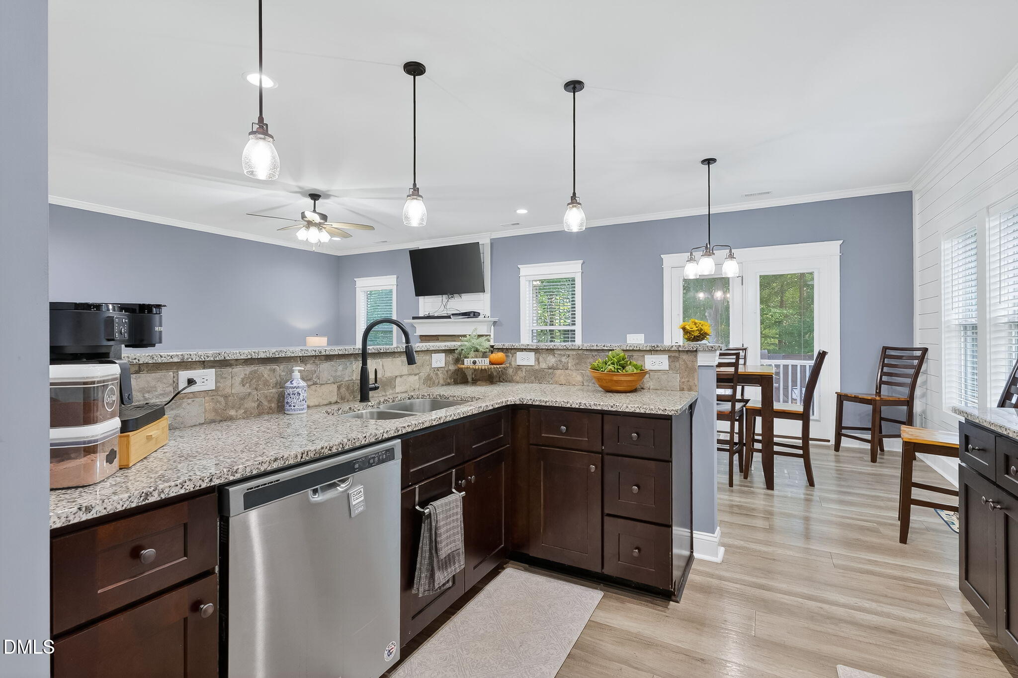 238 Deer Path Farms Road Erwin, NC 28339 - Photo 20 of 49 a kitchen with stainless steel appliances granite countertop wooden floors and sink