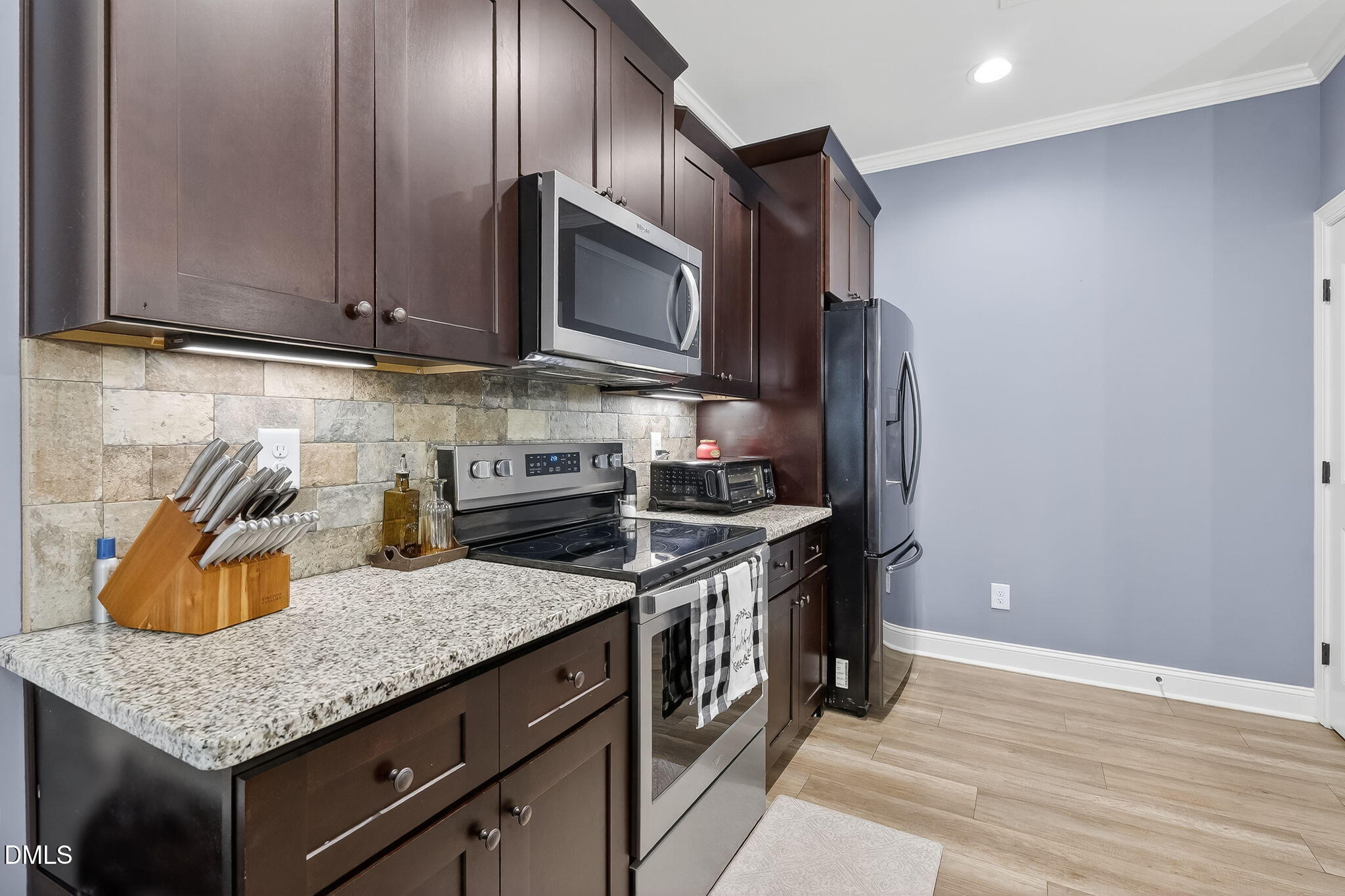 238 Deer Path Farms Road Erwin, NC 28339 - Photo 22 of 49 a kitchen with granite countertop stainless steel appliances and wooden cabinets