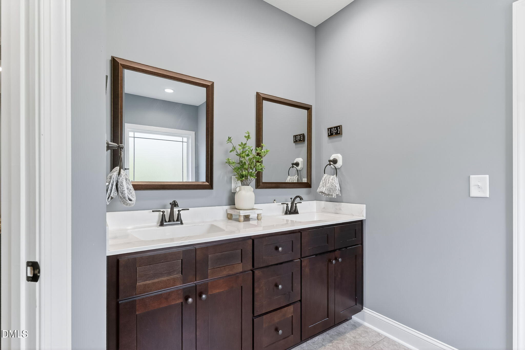 238 Deer Path Farms Road Erwin, NC 28339 - Photo 29 of 49 a bathroom with a double vanity sink and mirror