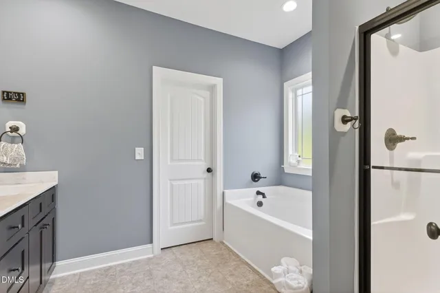a bathroom with a double vanity sink and mirror
