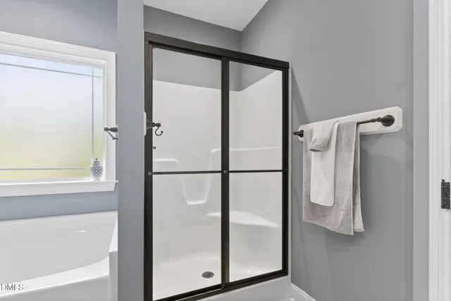 a white bath tub sitting next to a white sink