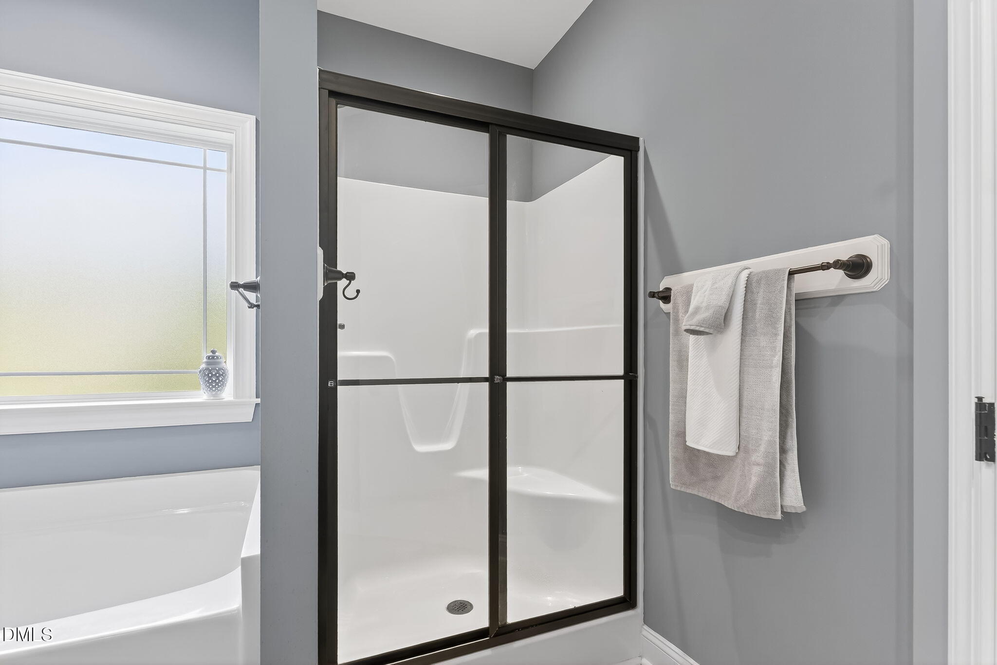 238 Deer Path Farms Road Erwin, NC 28339 - Photo 31 of 49 a bathroom with a glass shower door