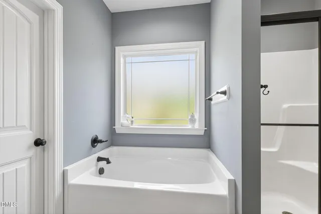 a bathroom with a glass shower door