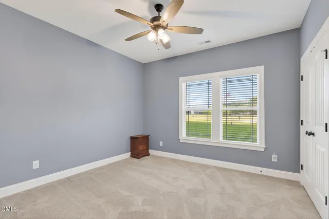 a white bath tub sitting next to a window
