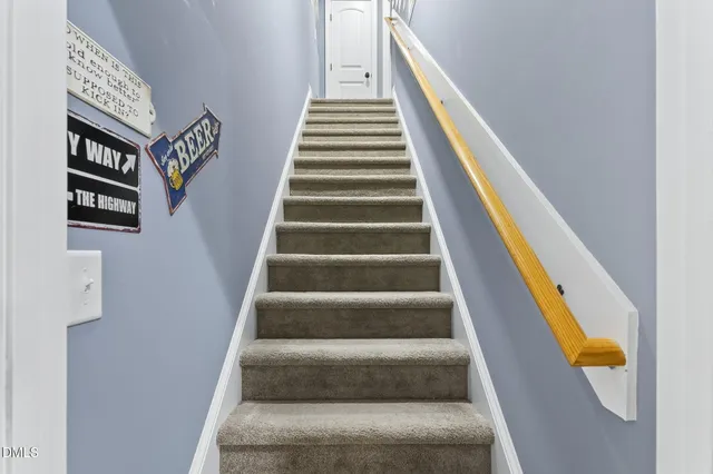 a bathroom with a sink a toilet and shower curtain