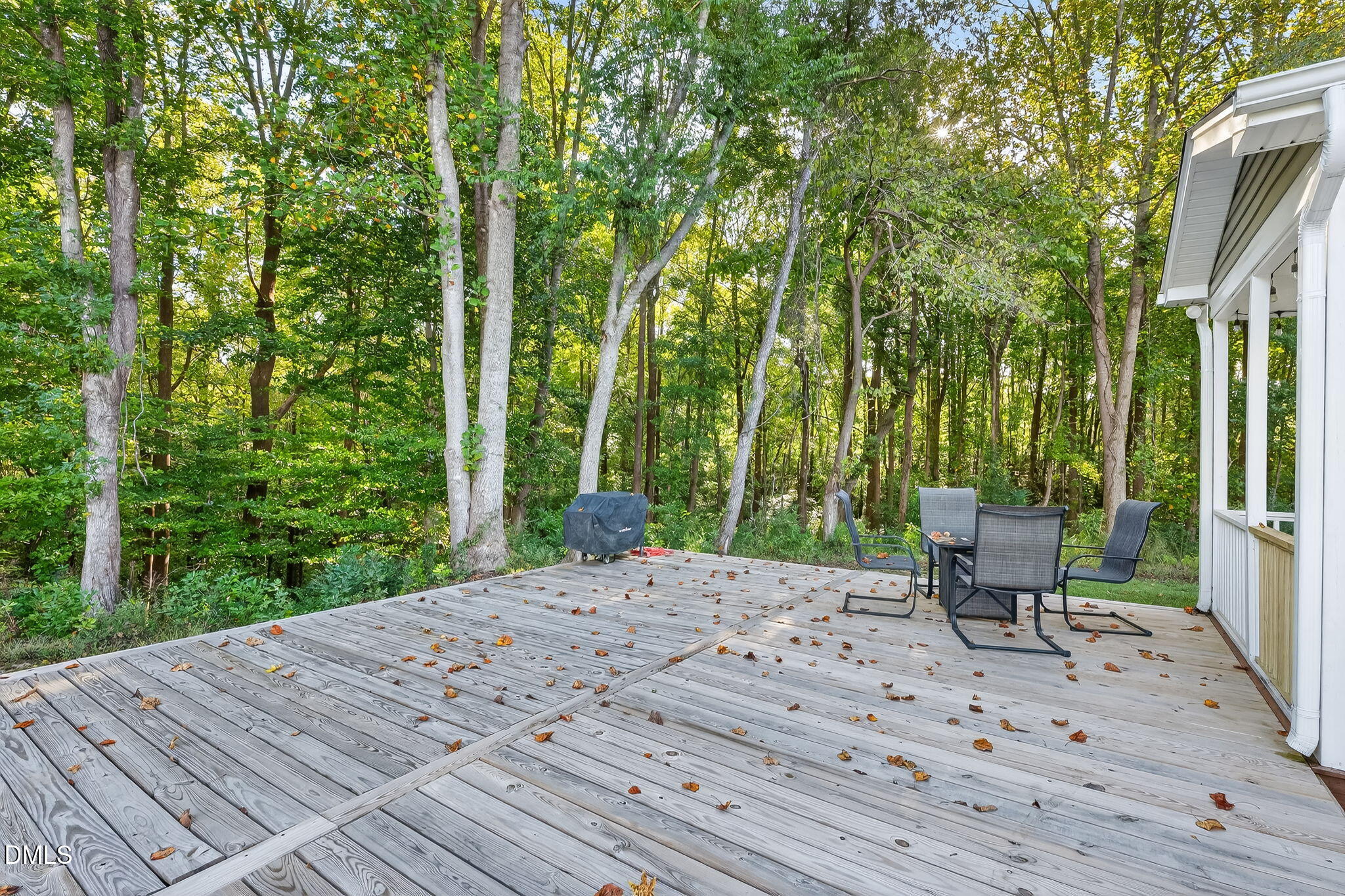 238 Deer Path Farms Road Erwin, NC 28339 - Photo 44 of 49 a view of a patio with table and chairs with wooden floor and fence