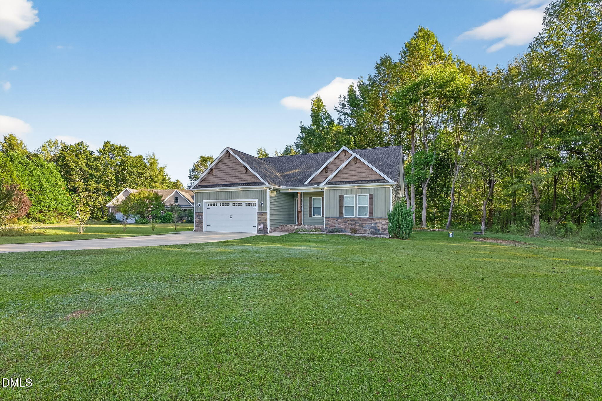 238 Deer Path Farms Road Erwin, NC 28339 - Photo 3 of 49 a front view of a house with garden