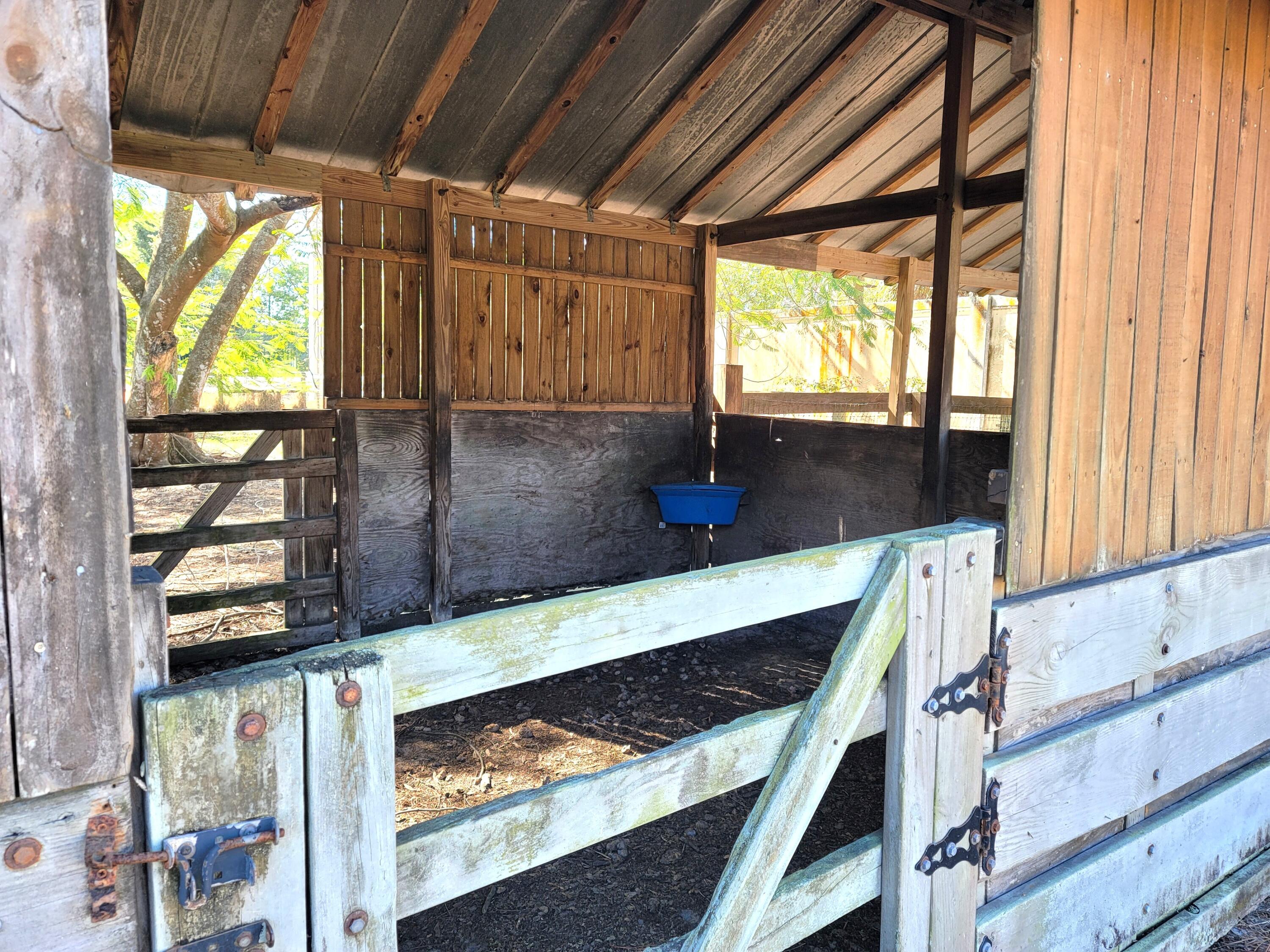 4362 West Midway Road Fort Pierce, FL 34981 - Photo 24 of 31 a view of kitchen with wooden floor and window