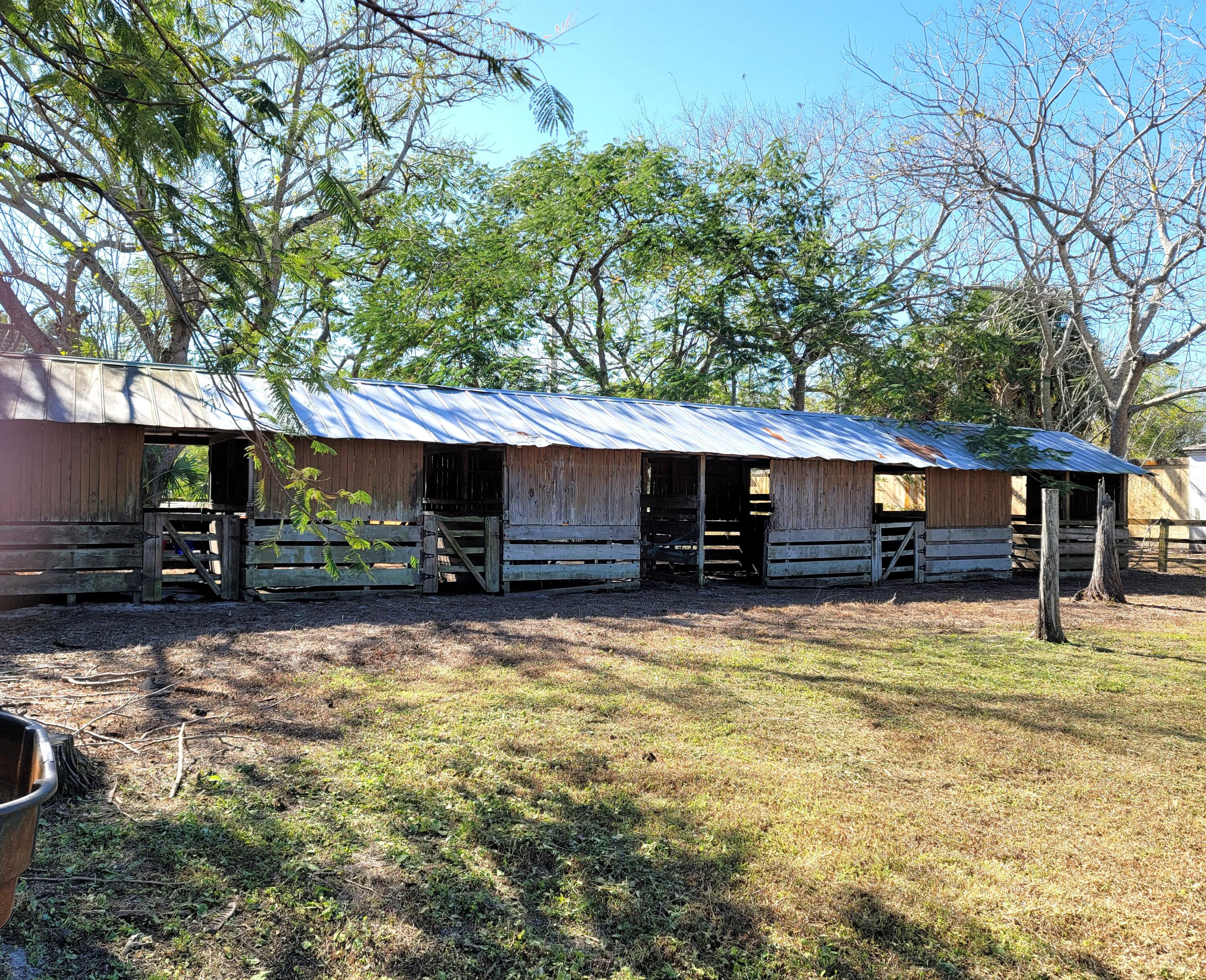 4362 West Midway Road Fort Pierce, FL 34981 - Photo 5 of 31 a view of a house with a yard outdoor and sitting area