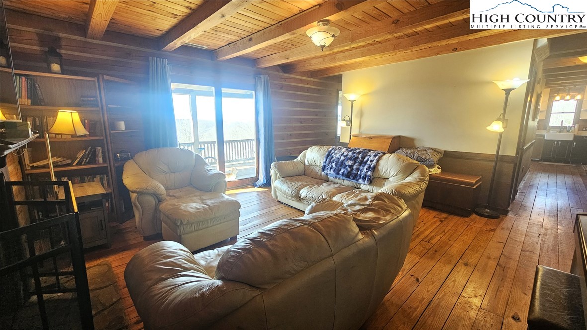 480 Schoolhouse Ridge Boone, NC 28607 - Photo 11 of 47 a living room with furniture and a fireplace