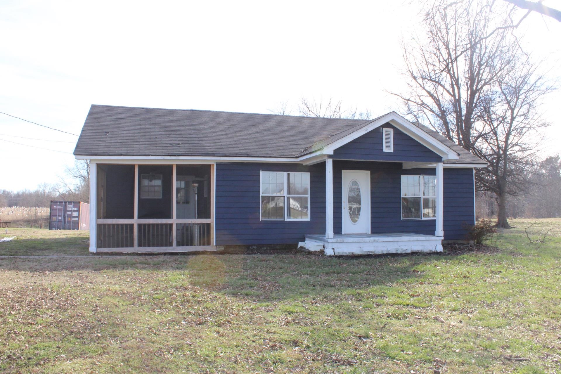 5787 Richardson Landing Road Drummonds, TN 38023 - Photo 1 of 37 a front view of a house with a garden