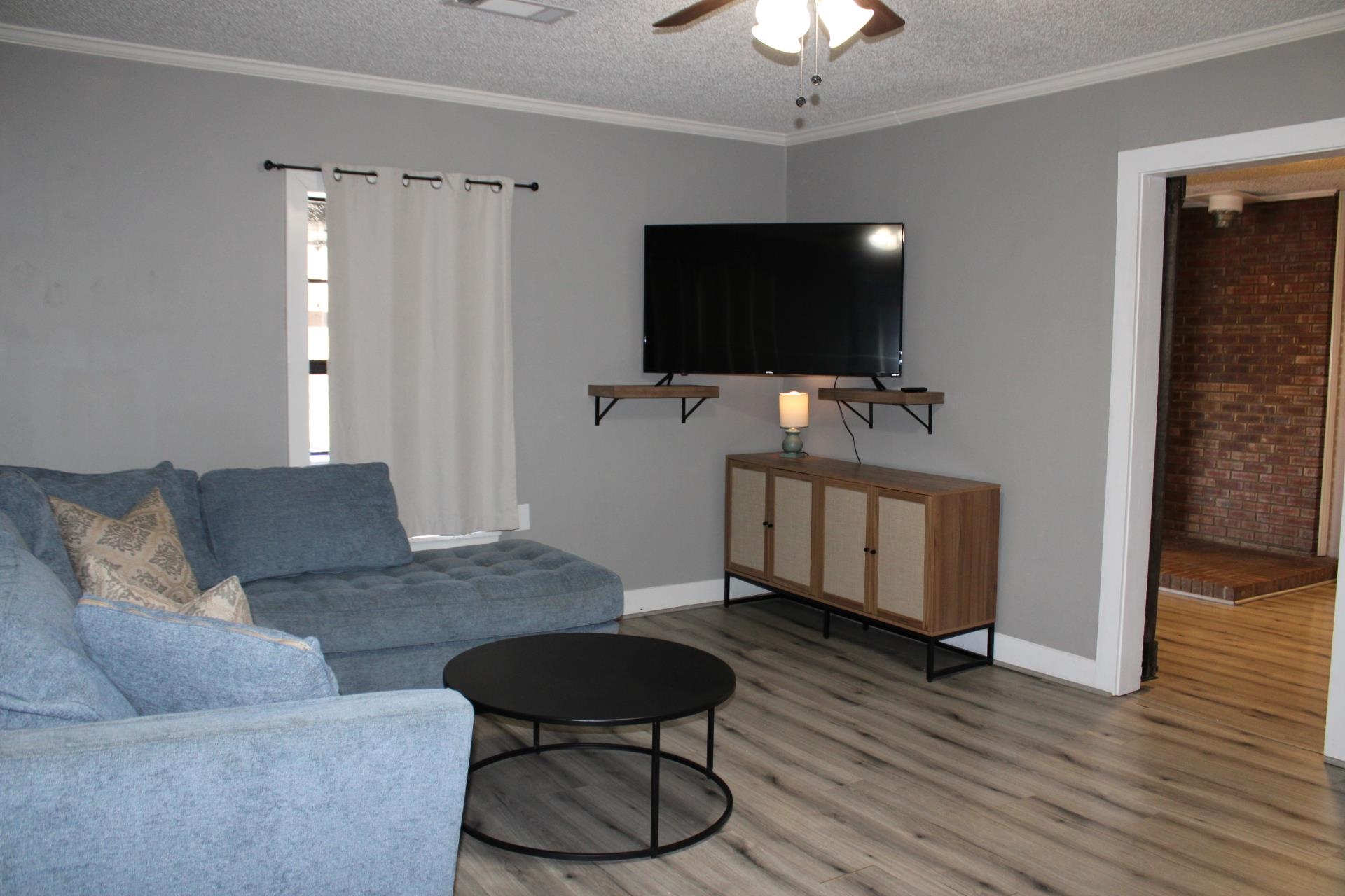 5787 Richardson Landing Road Drummonds, TN 38023 - Photo 15 of 37 a living room with furniture and a flat screen tv