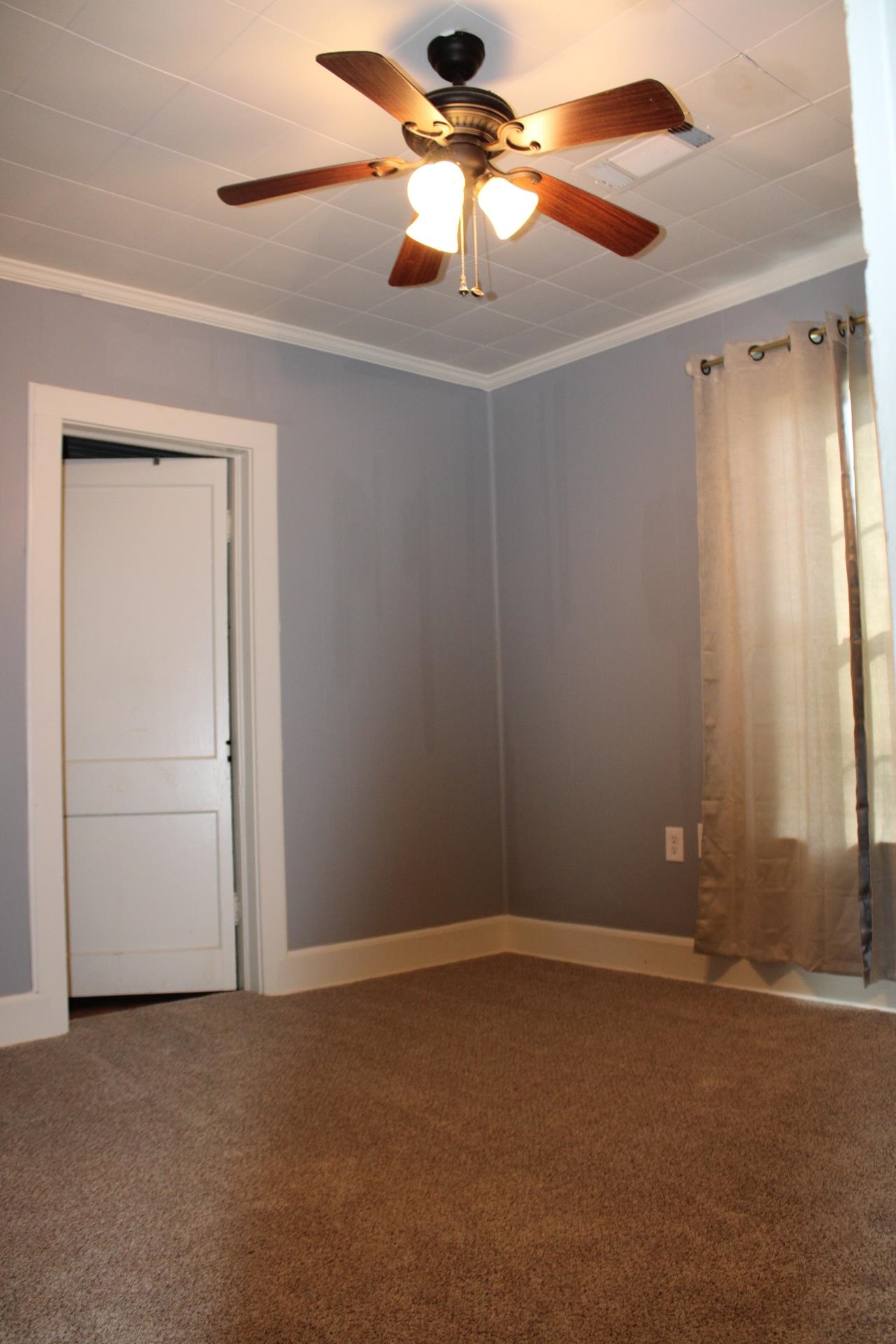 5787 Richardson Landing Road Drummonds, TN 38023 - Photo 20 of 37 an empty room with windows and fan