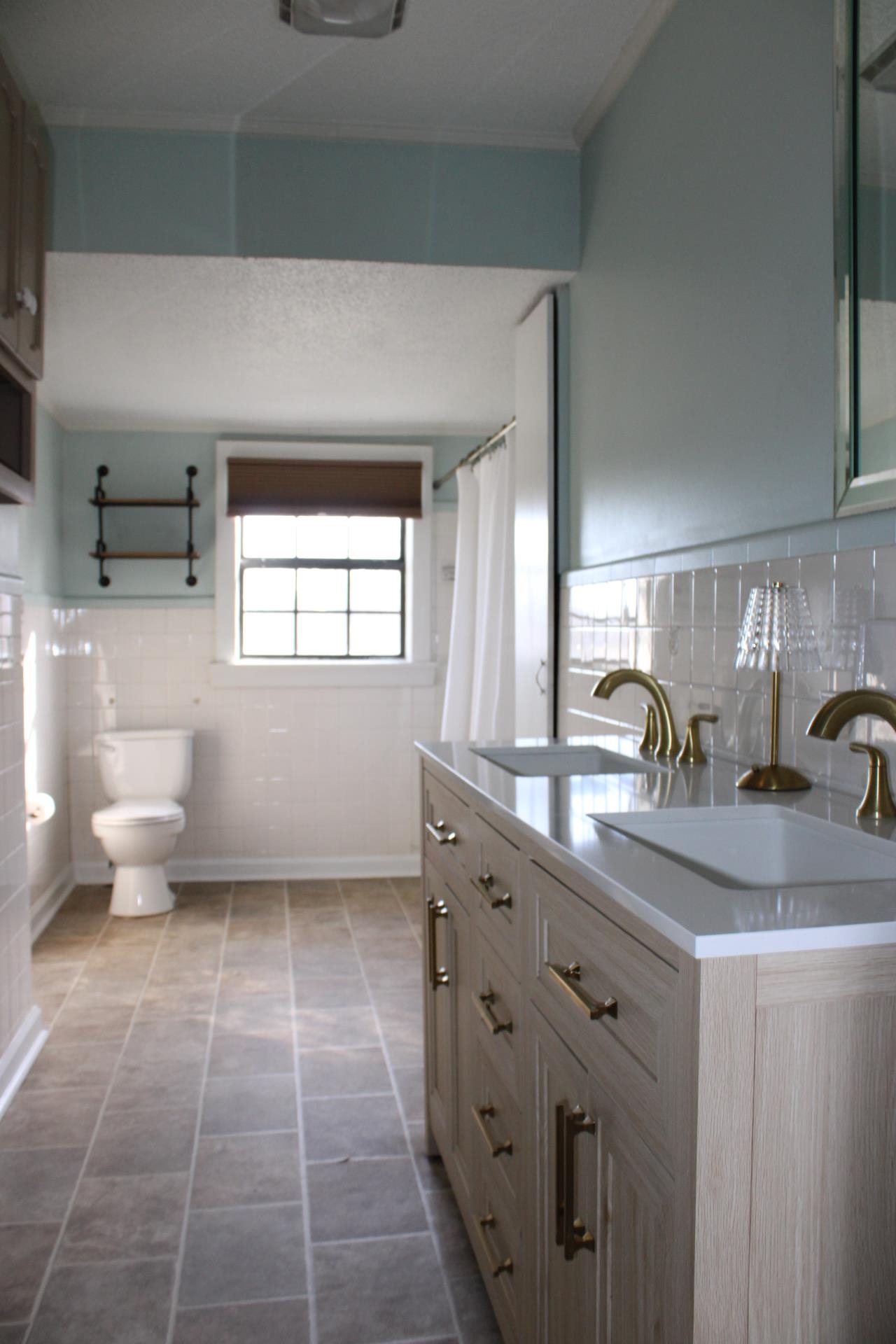 5787 Richardson Landing Road Drummonds, TN 38023 - Photo 22 of 37 a bathroom with a double vanity sink mirror and toilet