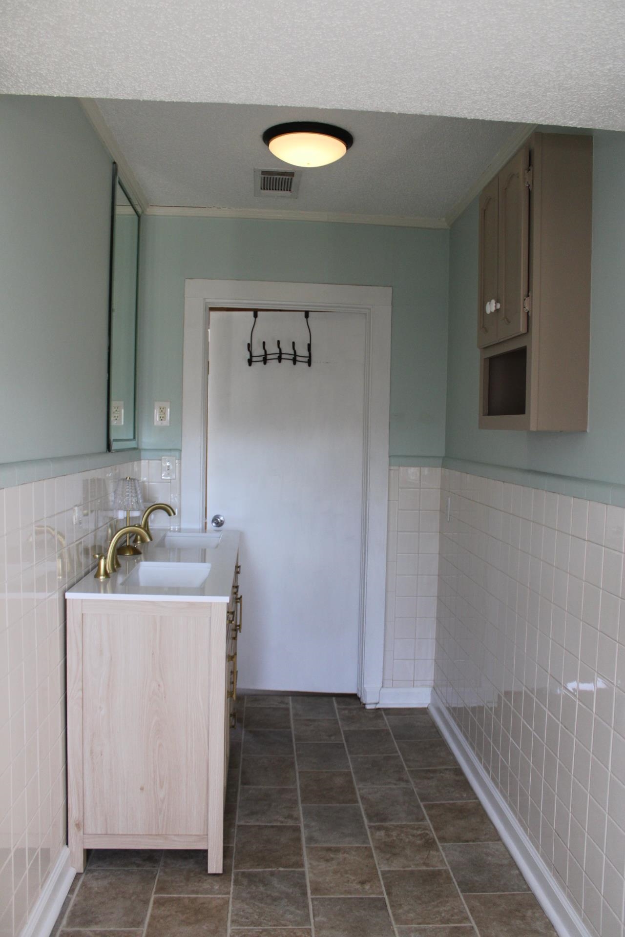 5787 Richardson Landing Road Drummonds, TN 38023 - Photo 23 of 37 a bathroom with a sink and a mirror