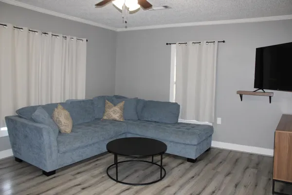 an empty room with wooden floor and closet