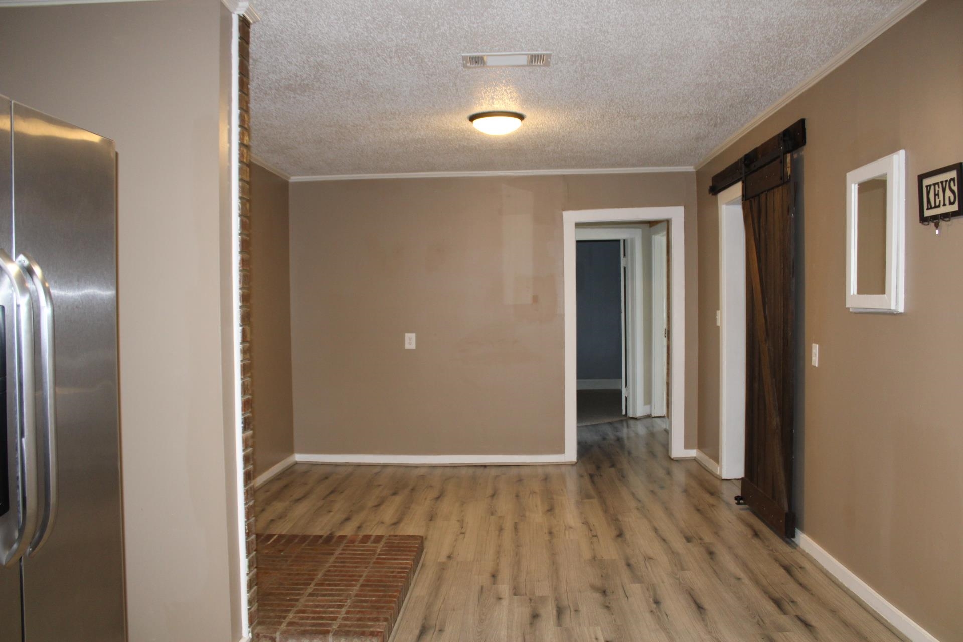5787 Richardson Landing Road Drummonds, TN 38023 - Photo 5 of 37 a view of hallway with wooden floor