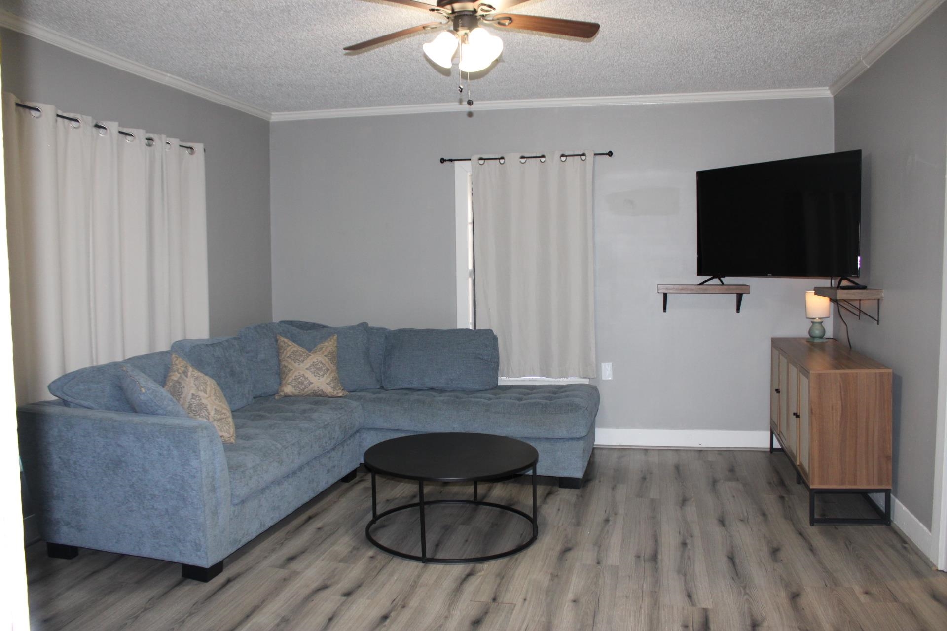 5787 Richardson Landing Road Drummonds, TN 38023 - Photo 7 of 37 a living room with furniture and a flat screen tv