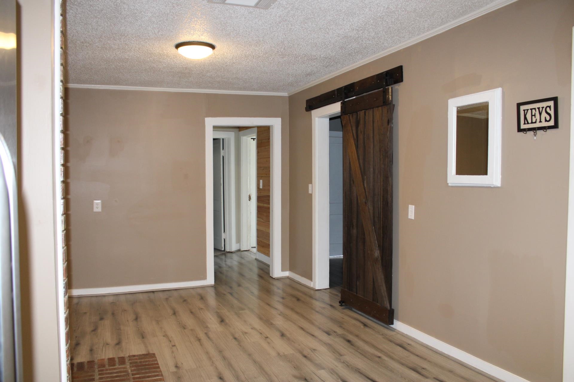 5787 Richardson Landing Road Drummonds, TN 38023 - Photo 10 of 37 an empty room with wooden floor and closet