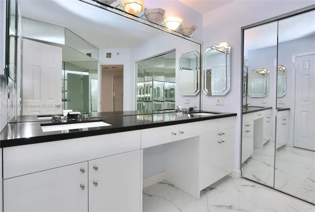 a bathroom with a double vanity sink mirror and double