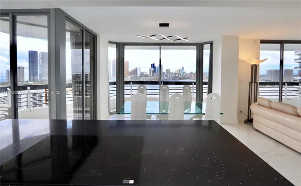 a view of large windows in a living room