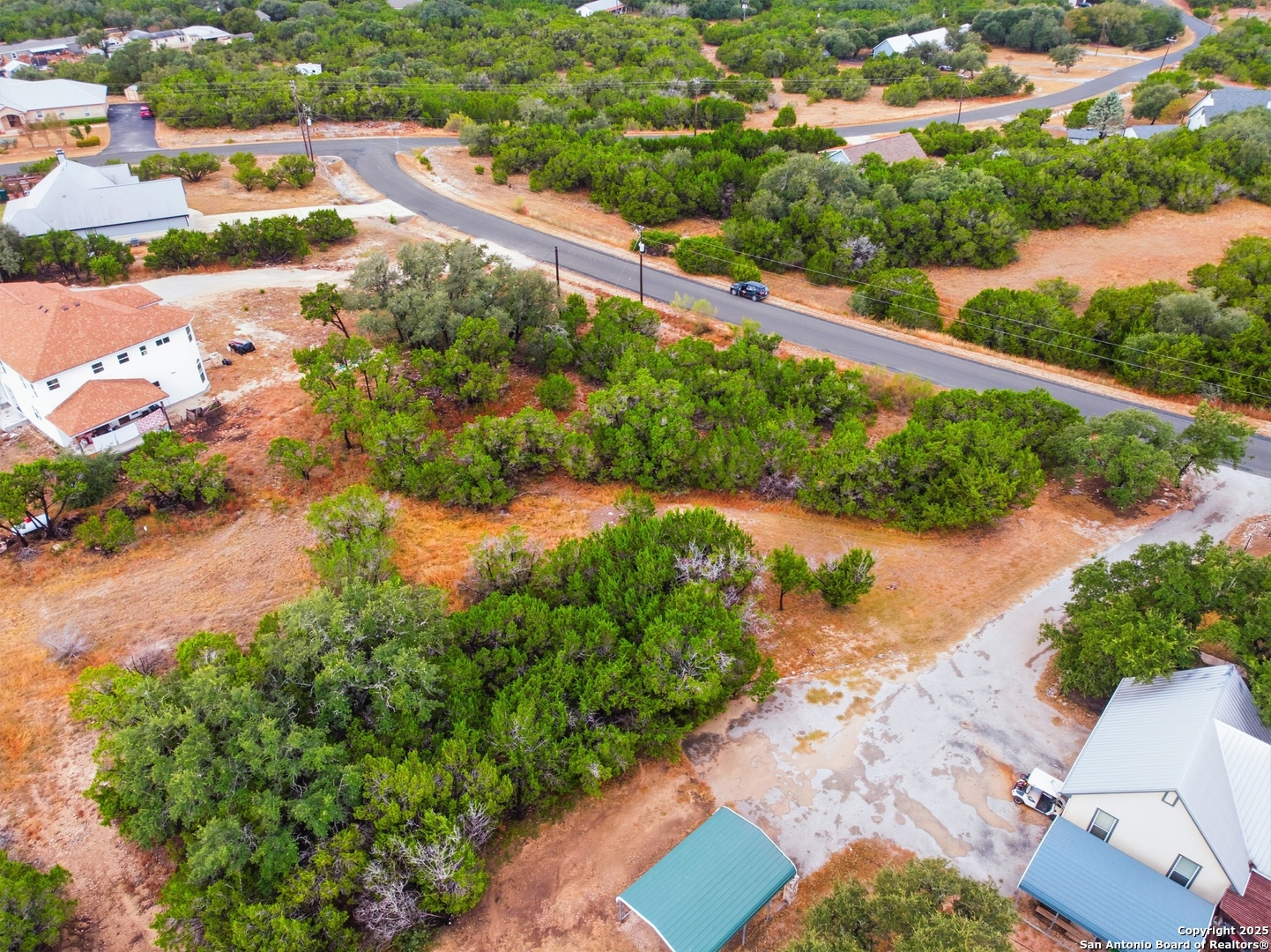 0 Lipizzan Spring Branch, TX 78070 - Photo 9 of 16 an aerial view of residential houses with outdoor space and trees all around