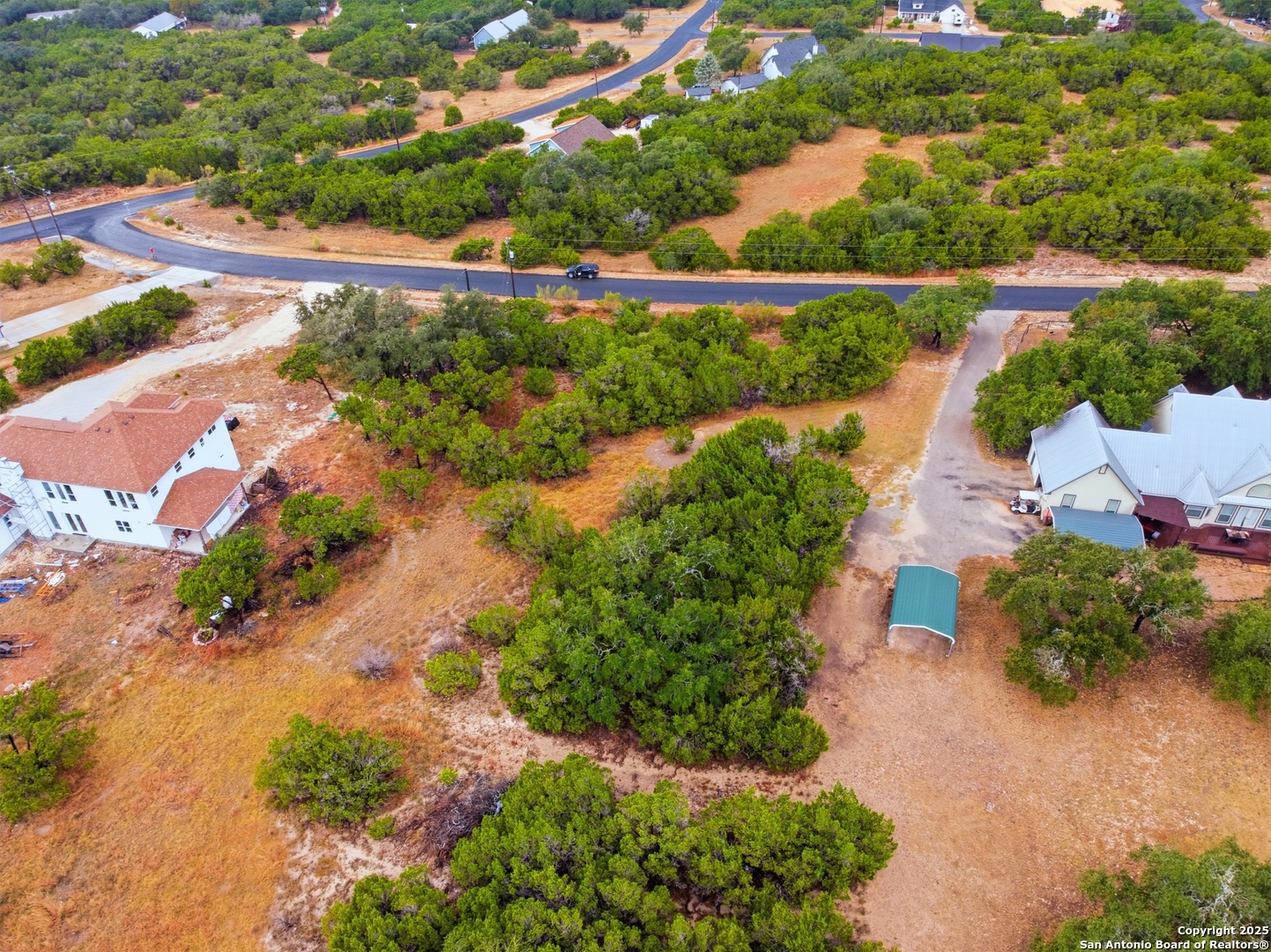 0 Lipizzan Spring Branch, TX 78070 - Photo 10 of 16 an aerial view of a house with a yard and lake view